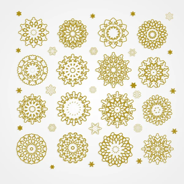 Collectie van gouden sneeuwvlokken op een witte achtergrond — Stockvector
