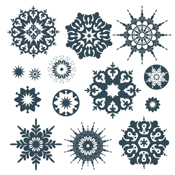 Колекція чорних сніжинок на білому тлі — стоковий вектор