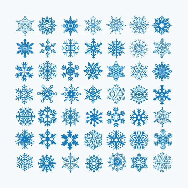 Colección de copos de nieve azules sobre fondo blanco — Vector de stock