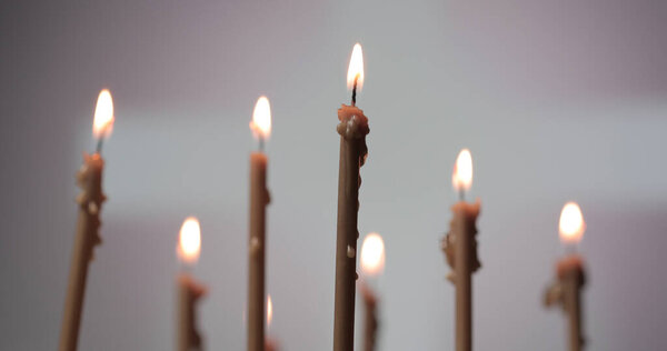 Candles burning on a church altar. Burning a candles on blurred background