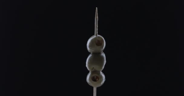 Rotating Toothpick Olive Black Background — Stock Video