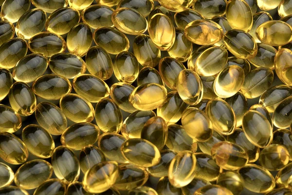 Bunch of fish oil capsules as background
