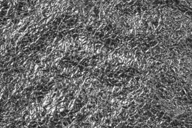 Parlak buruşuk yüzeyi olan gümüş folyo arka plan doku arkaplanı