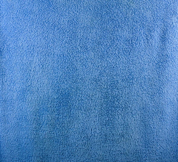 Een fijne textuur van blauwe badhanddoek. — Stockfoto