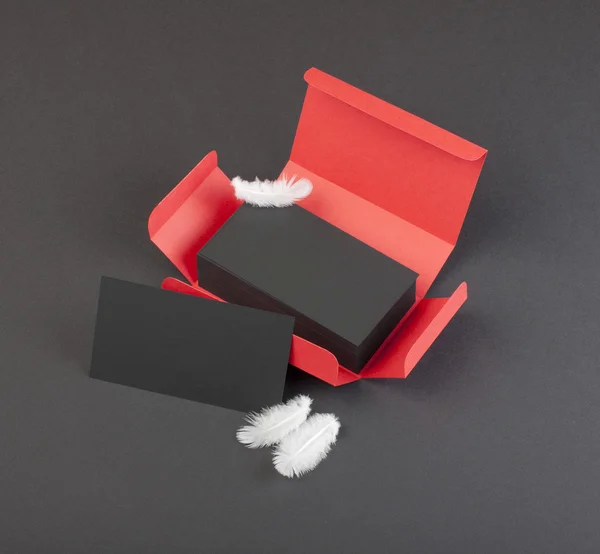 Black business cards in the red box. — Stock Photo, Image