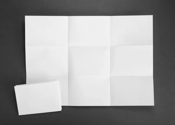 White sheet of paper folded in nine top shooting — Stock Photo, Image