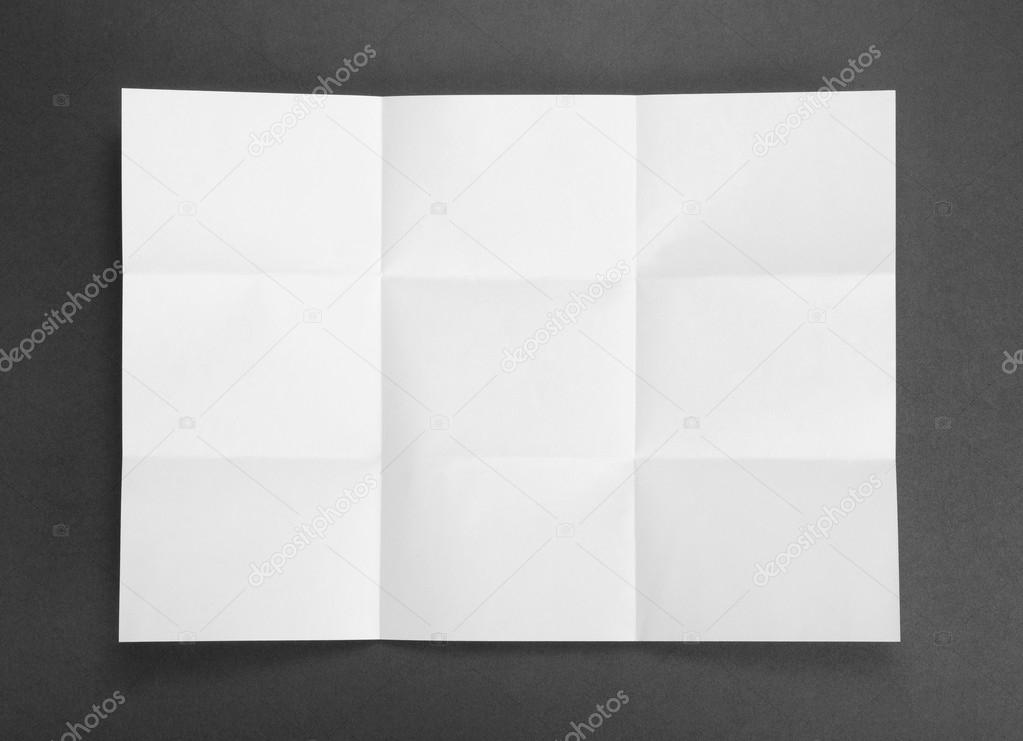 White sheet of paper folded in nine top shooting.