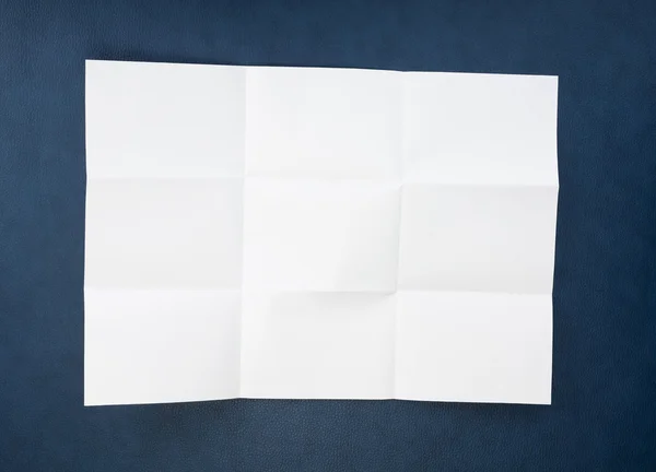 Белый лист бумаги сложенный в девять топ съемки . — стоковое фото