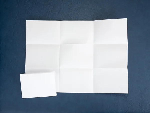 Fehér papírlapot összehajtva kilenc top lövés. — Stock Fotó