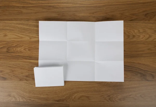 Feuille de papier blanche pliée en neuf prises de vue . — Photo