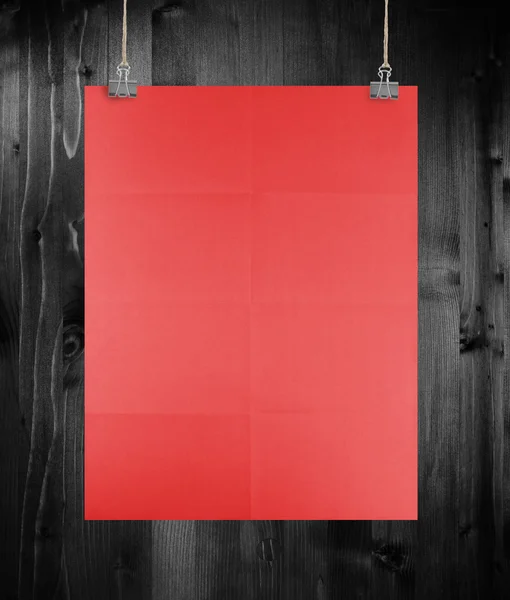 Red poster on a wood wall. — Stock Photo, Image