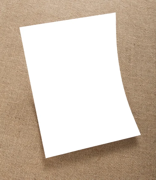 Blank flyer poster on burlap background to replace your design. — Stock Photo, Image