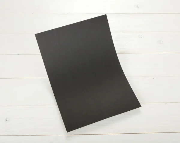 Blank flyer poster on wood to replace your design. — Stock Photo, Image