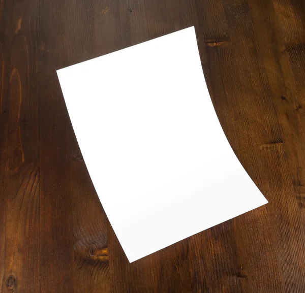 Blank flyer poster on wood to replace your design. — Stock Photo, Image