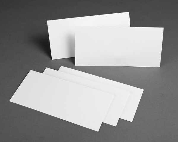 Blank flyer poster over grey background to replace your design.