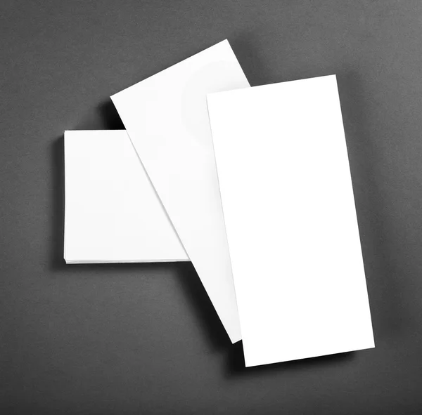 Blank flyer poster over grey background to replace your design. — Stock Photo, Image