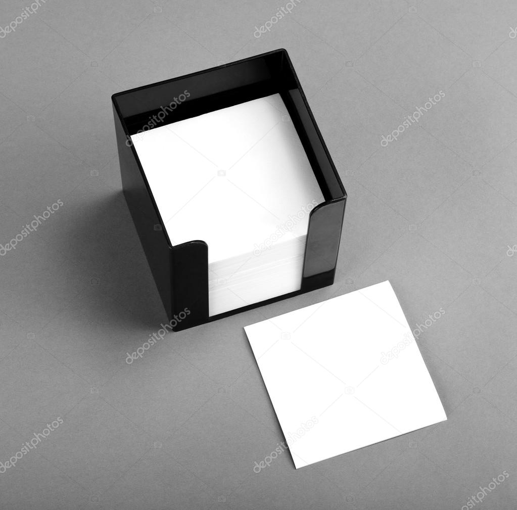 Black leather memo pad holder with blank white memo paper.