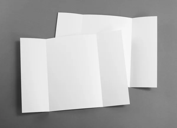 Blank gate fold brochure on grey to replace your design. — Stock Photo, Image
