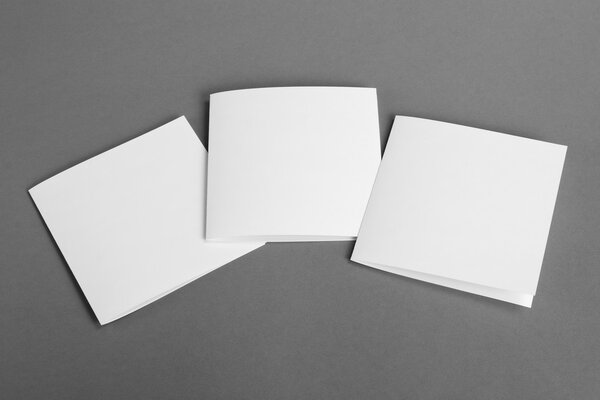 White empty  cards on grey to replace your design