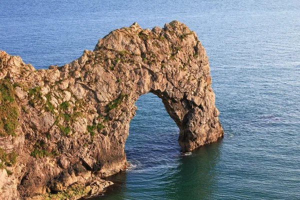 Stone arch in the water — Stock Photo, Image