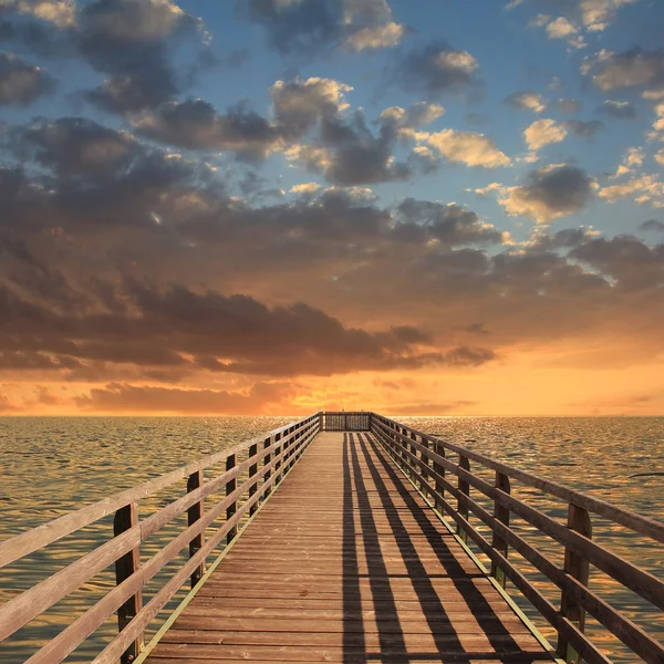 Wooden landing stage, sunset scenery Stock Image