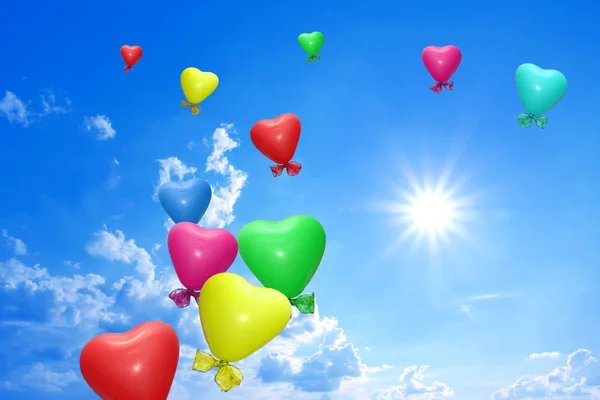 Beautiful sunny sky with colorful balloons — Stock Photo, Image