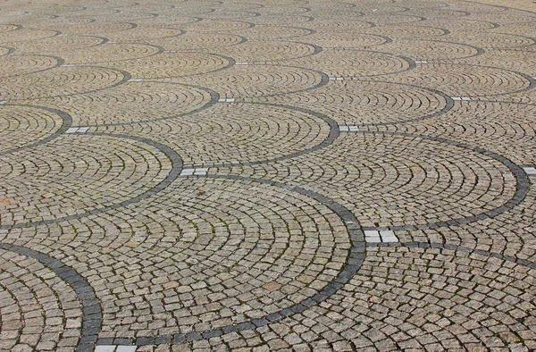 Cobblestone pavement with fish scale pattern — Stock Photo, Image