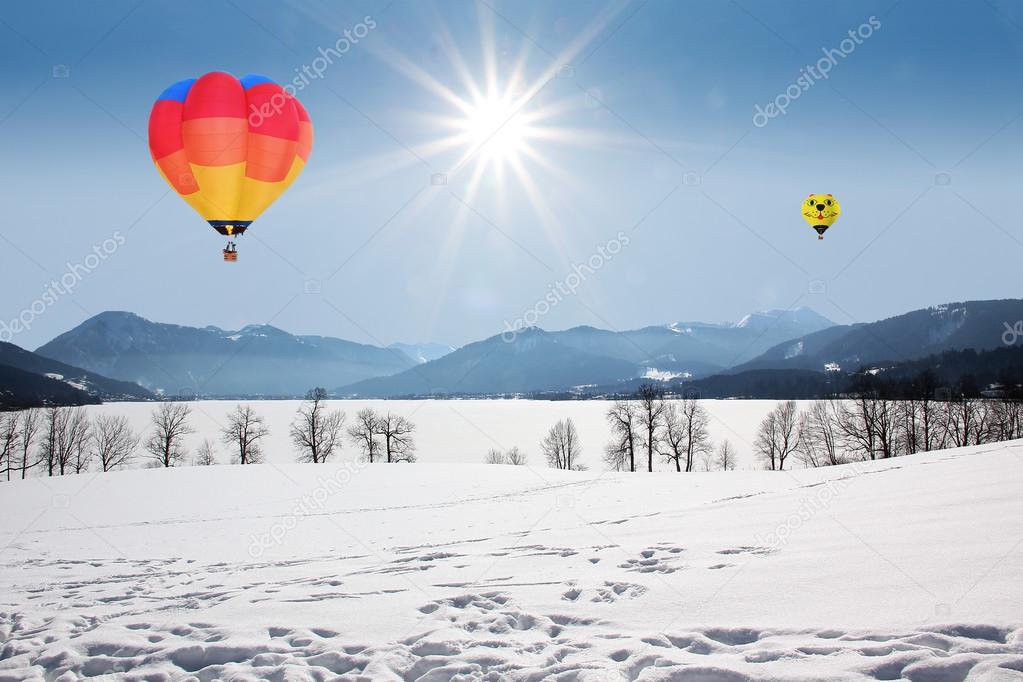 floating hot air balloons over lake tegernsee, germany