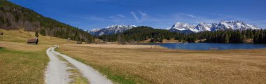 hiking trail around lake geroldsee, panoramic view to karwendel  clipart
