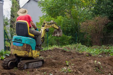 groundwork with a mini digger clipart
