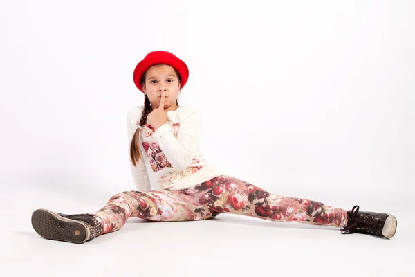 Little girl sitting on the floor — Stock Photo, Image