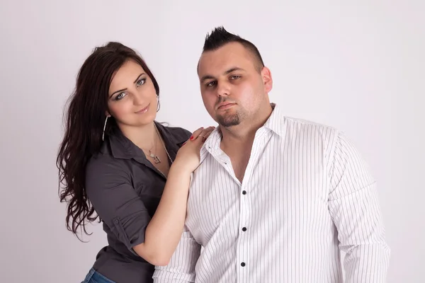 Young couple in studio — Stock Photo, Image