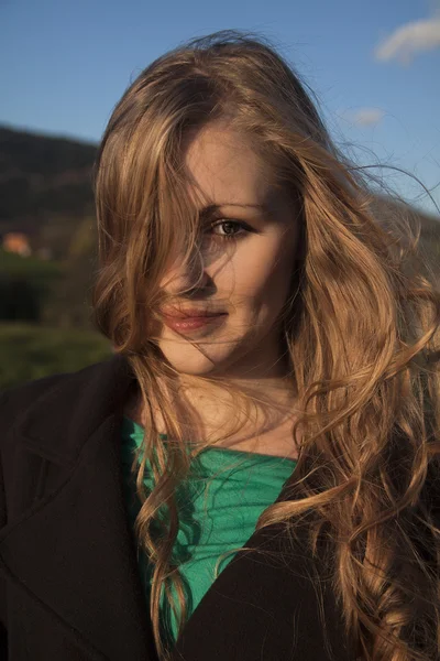 Young long-haired curly blonde woman — Stock Photo, Image