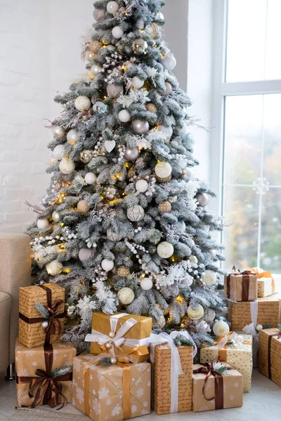 Close up Christmas tree decorated and gift boxes. No people. Home comfort of modern house. — Stock Photo, Image