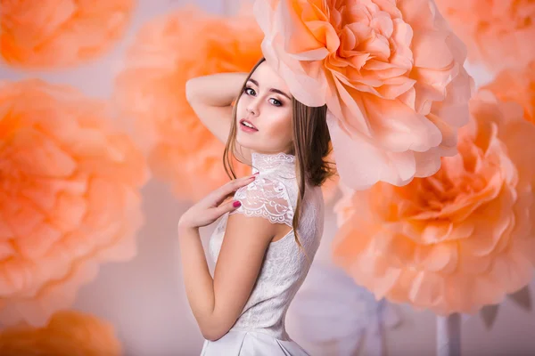 Portrait of young beautiful girl in paper flowers — Stock Photo, Image