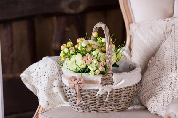 Basket with tulips on vintage sofa — Stock Photo, Image