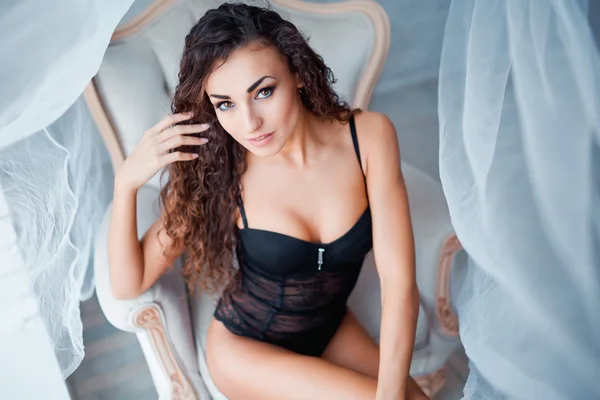 Perfect, sexy body of young woman wearing seductive black lingerie — Stockfoto
