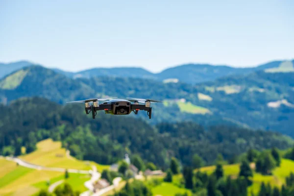 Flying drone,equipped with a drone camera in the air while shooting in Slovenia
