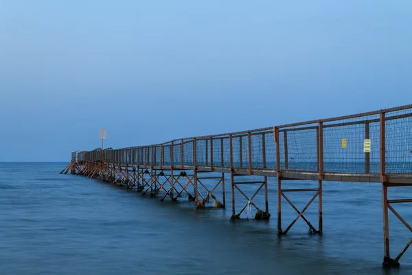 Sunset pier at beach — Stock Photo, Image