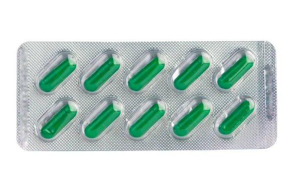 Green capsule in  blister pack — Stock Photo, Image