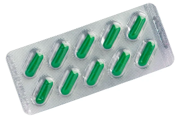 Groene capsule onder blister — Stockfoto