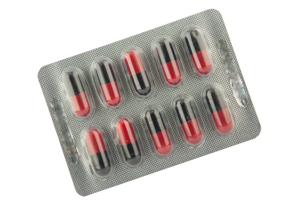 Cápsula negra y roja en blíster Mostrar concepto de medicamento —  Fotos de Stock