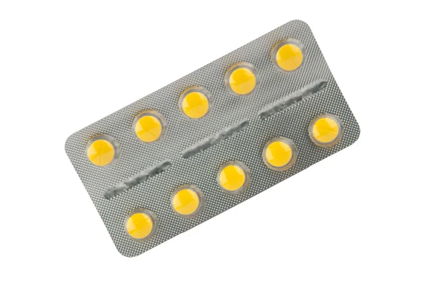 Yellow tablet in blister tablet — Stock Photo, Image