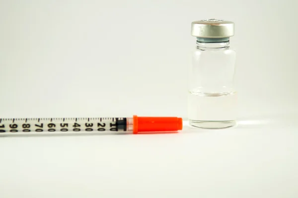 Medical syringe and injection vial — Stock Photo, Image