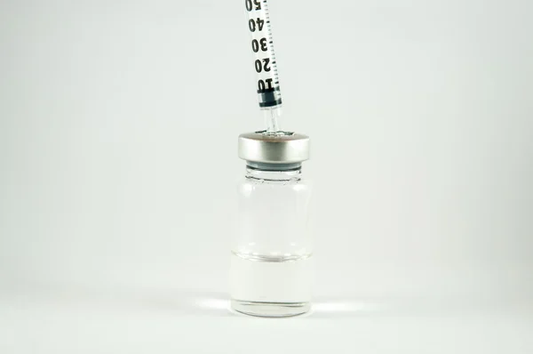 Injection vial and syringe — Stock Photo, Image