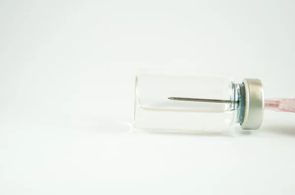 Closed up needle put in vial — Stock Photo, Image