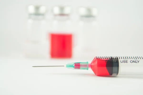 Injection syringe and vials background — Stock Photo, Image
