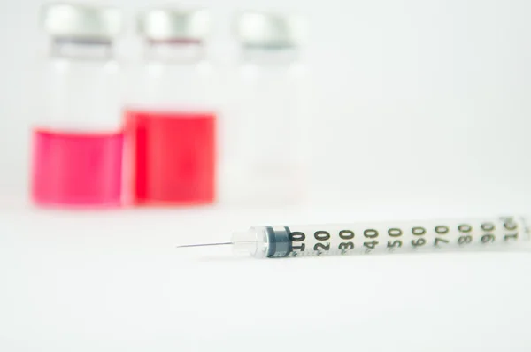 Injection syringe and vials background — Stock Photo, Image