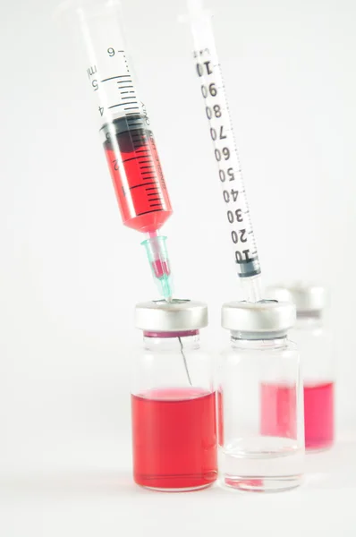 Action of liquid pump from medicine vial by injection syringe — Stock Photo, Image