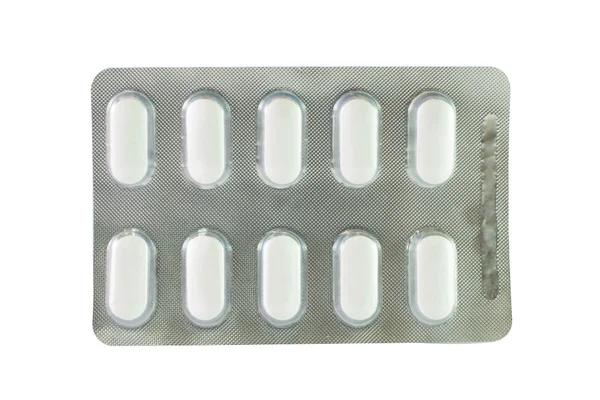 Белая таблетка в блистерной упаковке — стоковое фото